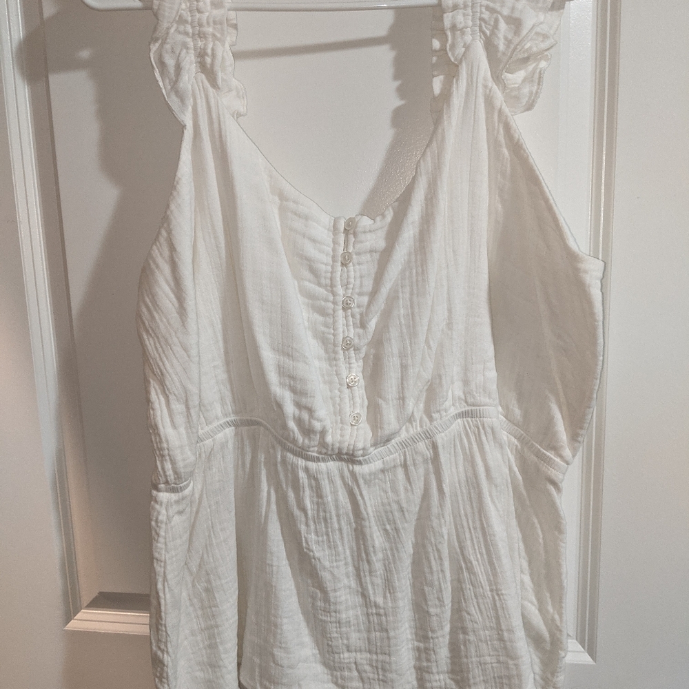 Maurice's white tank